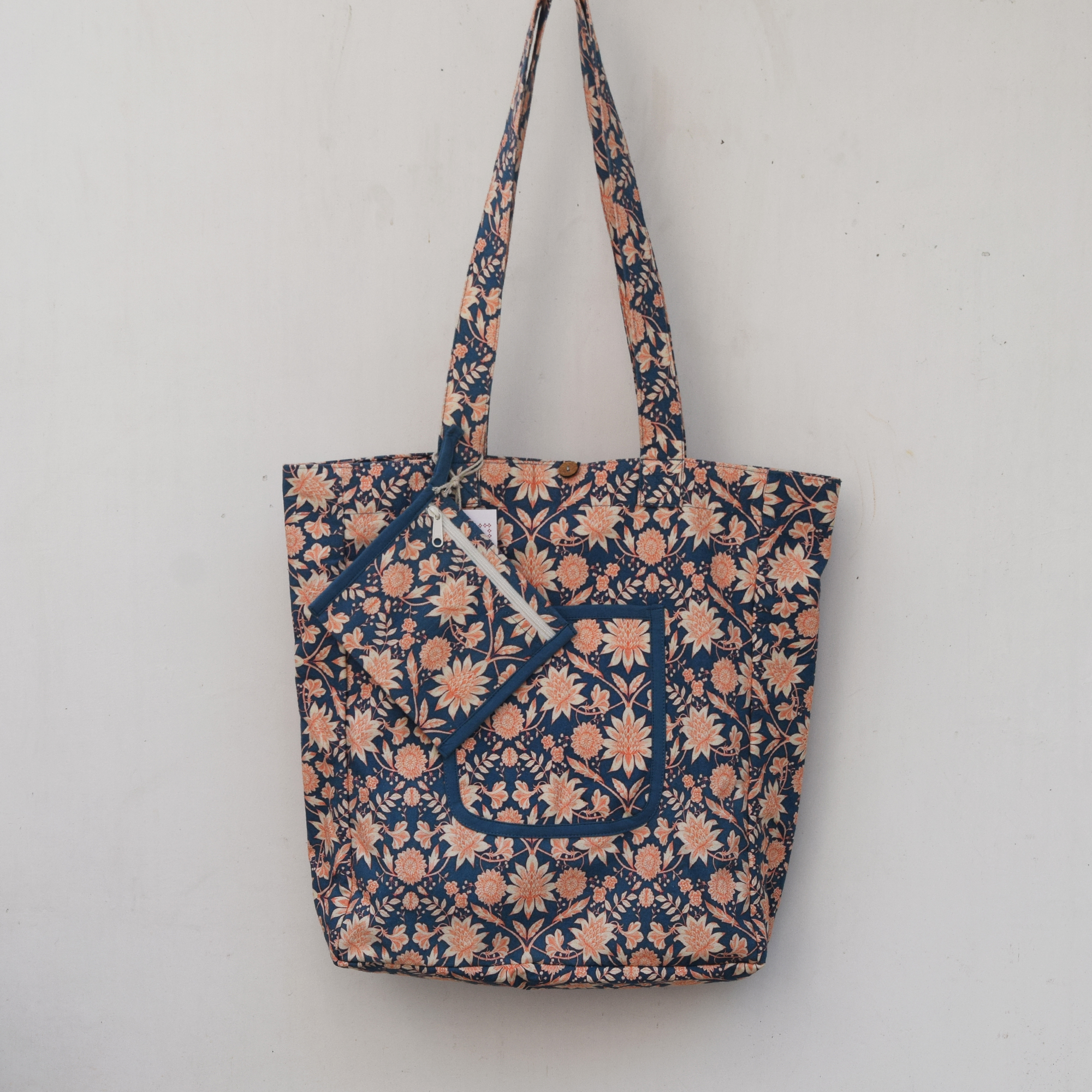 Floral printed canvas tote bag with matching zipper pouch – blue and peach colors